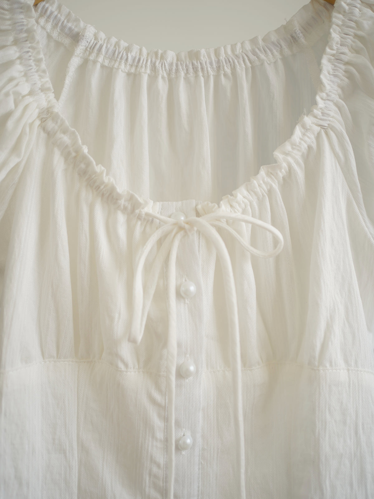 Sofina Ruffle Button Top
